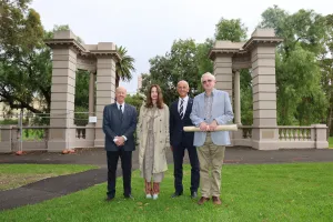 Cr Rowan Story, Ms Fiona Mackay, Mayor Stretch Kontelj, Dr David Mackay standing on the grass with the Hitchcock Memorial Gateway in the background.