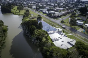 Open space includes parks, gardens, sports reserves and waterways. An aerial photo of a river, basketball court and green areas.