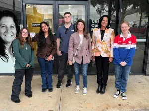 Bella, Thoorigai, Jye, Alison Marchant MP, Christine Couzens MP and Pippa. Young adults and politicians standing in a line smiling