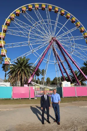 Mayor Stretch Kontelj and Brandon Verfurth in front of the Giant Sky Wheel at the waterfront. Greater Geelong Mayor Stretch Kontelj is standing with Giant Sky Wheel and café and Waterfront Train operator Brandon Verfurth in front of the Giant Sky Wheel at the waterfront.