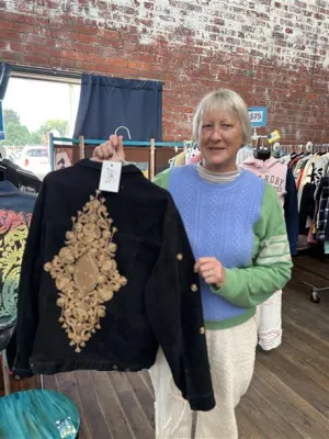 Image of lady holding a jumper