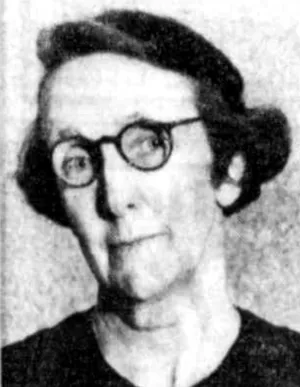 Black and white photo of woman with round black rim glasses