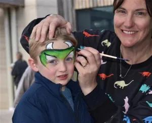 Image of little boy having his face painted