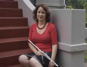Image of lady holding flute