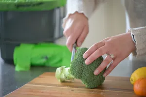 Woman cutting vegetables to make a meal