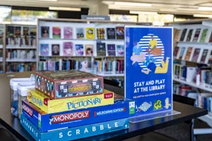A stack of board games at a library