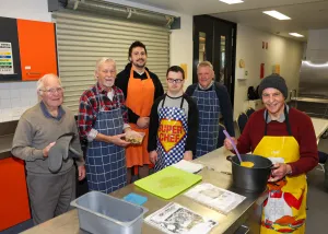Men's Kitchen cooking class at Vines Road Community Centre. A group of men standing in a kitchen