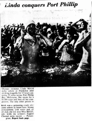 Newspaper article with black and white photo of woman in water with well wishers behind her