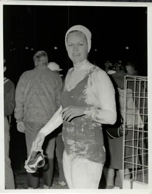 Woman standing next to shark cage