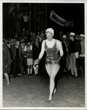 Woman walking with well wishers behind her