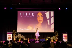 Young performer on stage singing