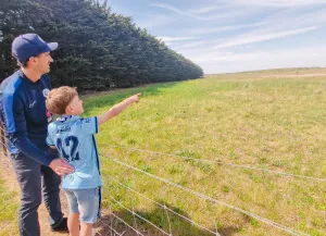 Peter and Freddy Wilkinson look out across future Devlins Road soccer precinct.