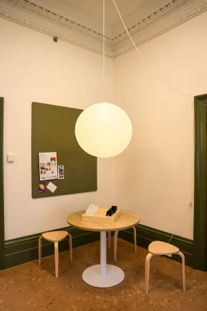Table with chairs and a hanging light