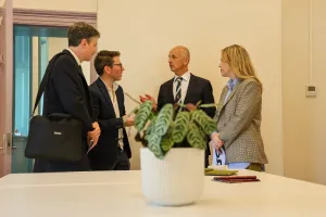 Four people talking