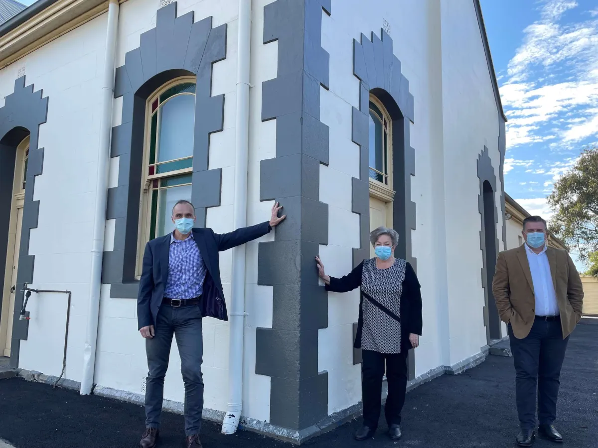 Councillors Eddy Kontelj (left) and Anthony Aitken with Osborne Park Association president Cheryl Scott at the renovated Osborne House stables. (Photograph taken prior to lockdown.)